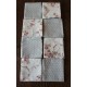 Un lot de 8 serviettes de table gris bleu Pois Fleurs roses